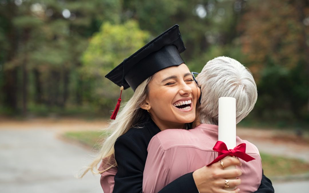 Girl and Grandmother Hugging at Graduation
