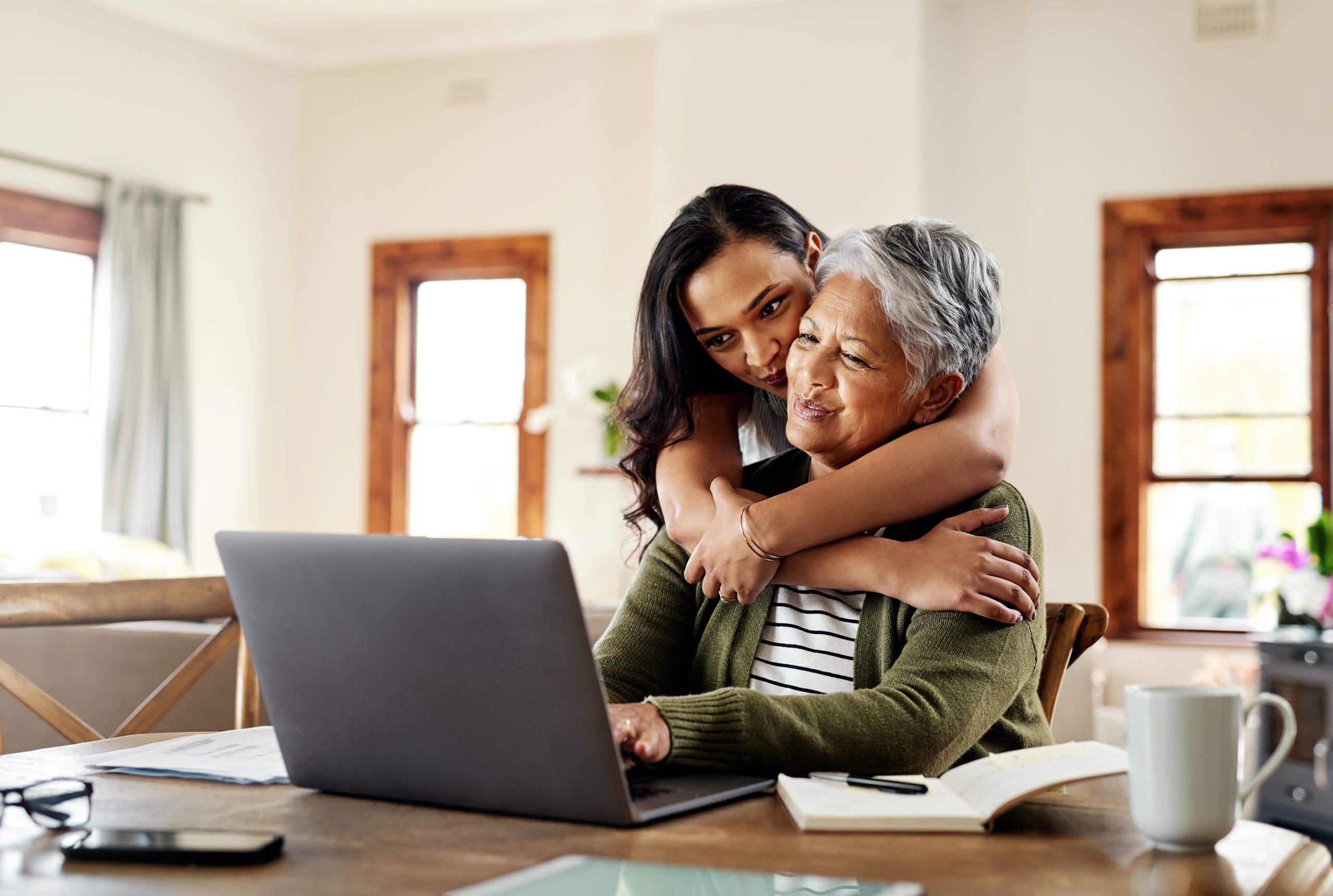 Mother and daughter looking at a financial plan