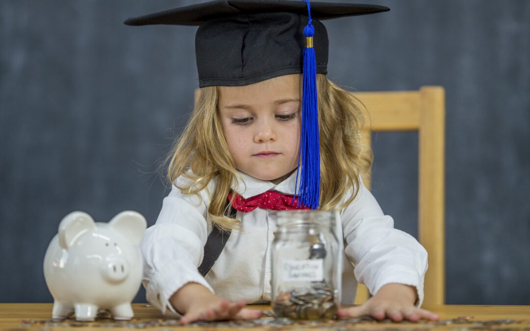 Child saving money in piggy bank to add to their 529 plan to save for college