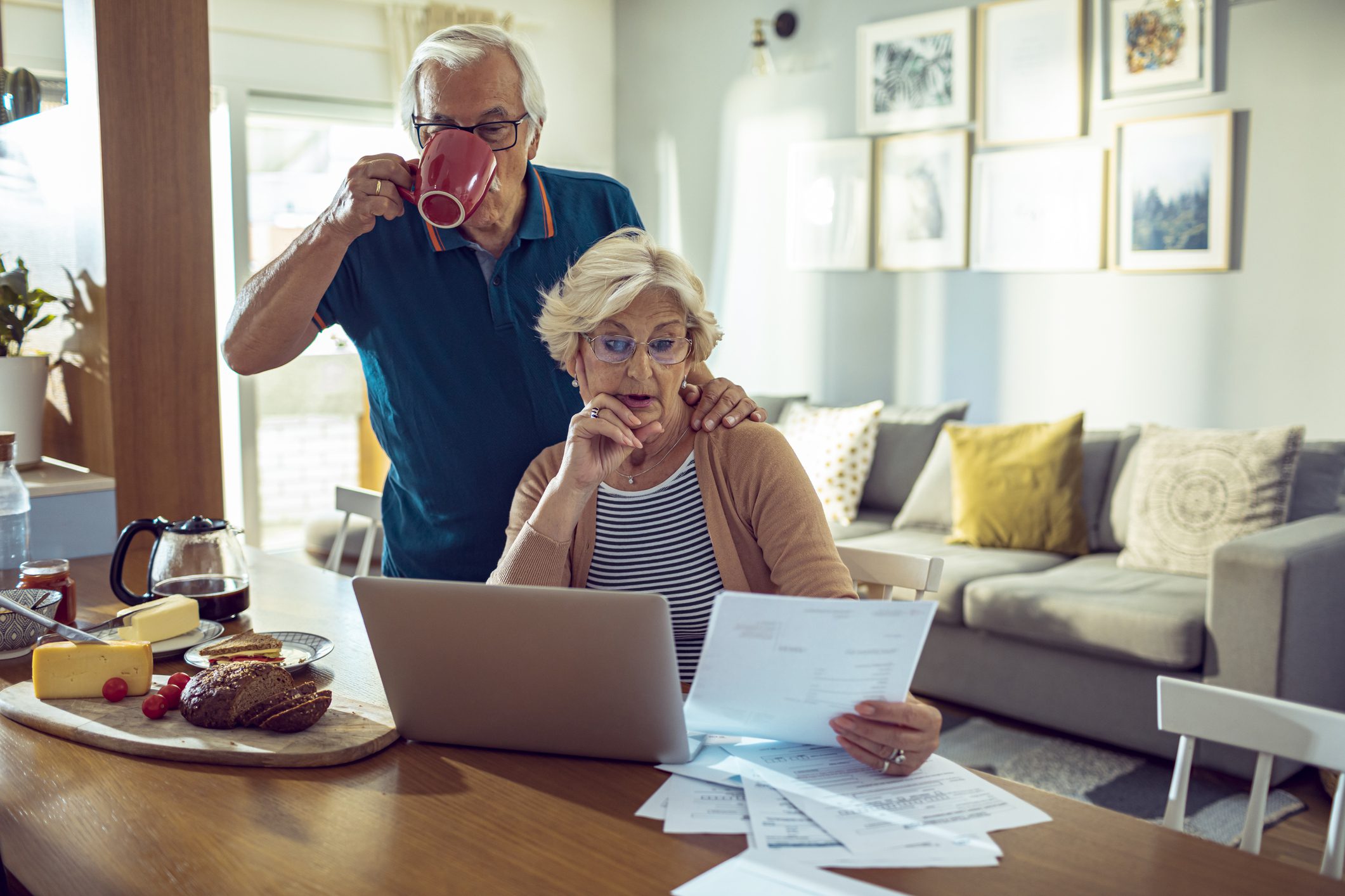 Older couple discussing an inherited IRA and looking at their finances