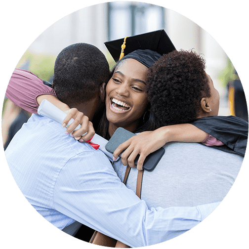 family wealth management and family wealth transfer image of woman at graduation hugging parents