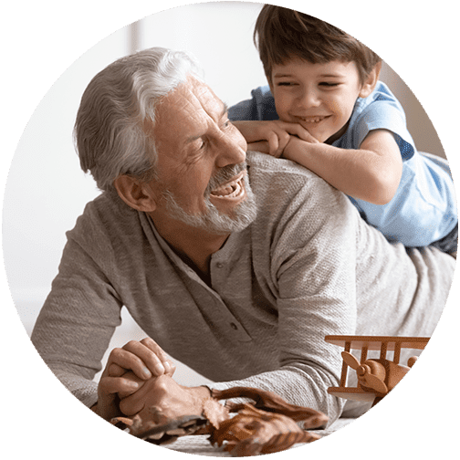 investment management and wealth management image of young child playing with grandfather