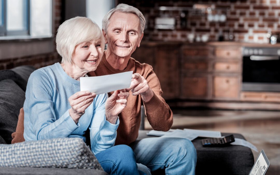 Good for you. Smiling male person embracing his wife while pointing at counting