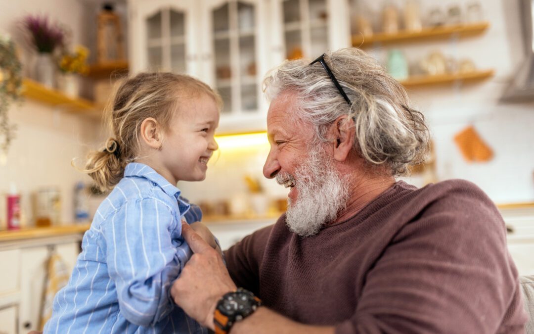 Grandpa playing with his grandson at home