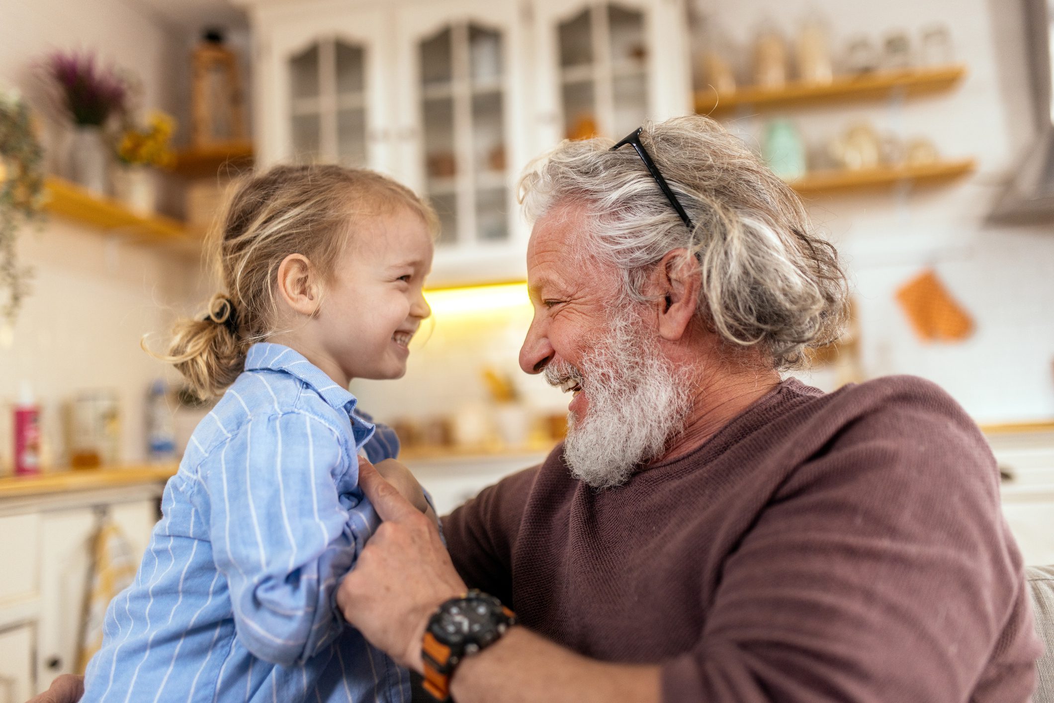 Grandpa playing with his grandson at home Grandpa playing with his grandson at home