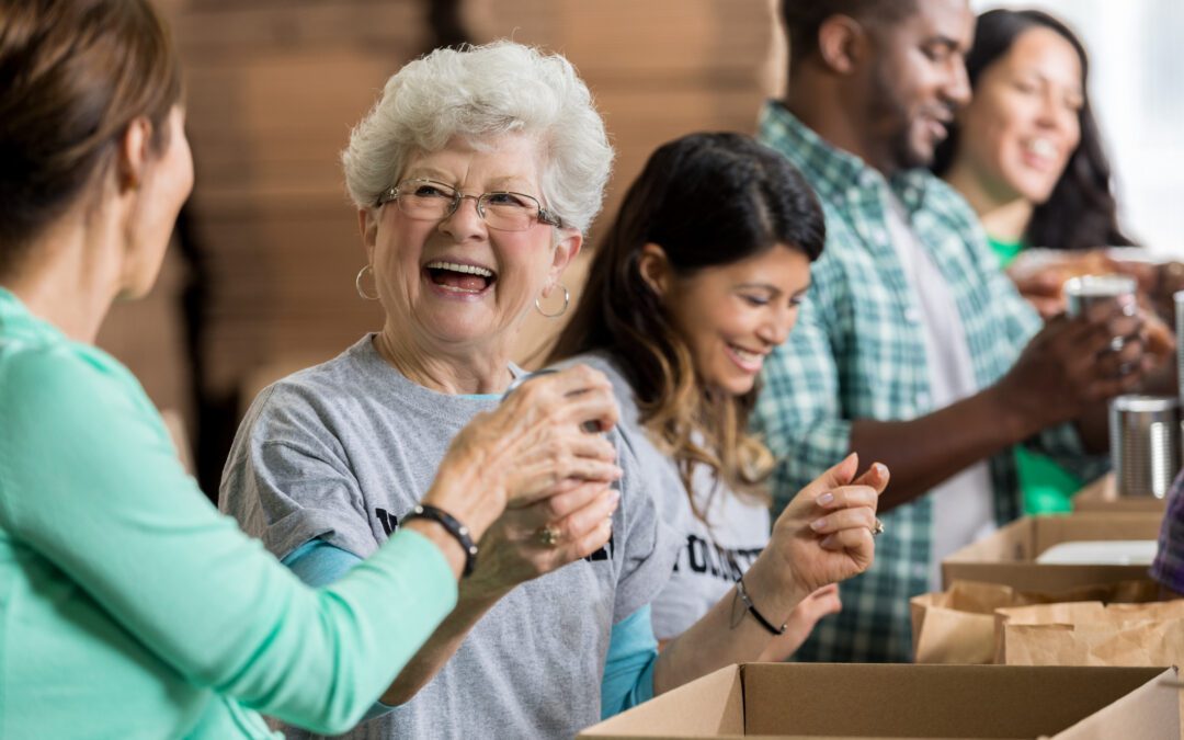 Beautiful cheerful senior woman volunteers at food bank